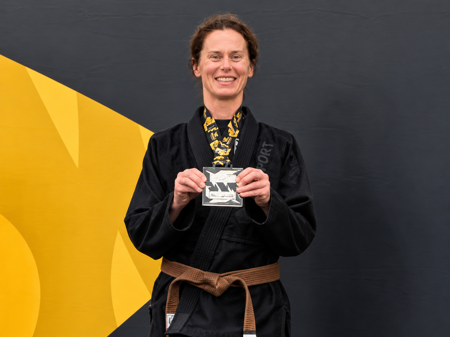 Christine Unruh with her silver medal and brown belt