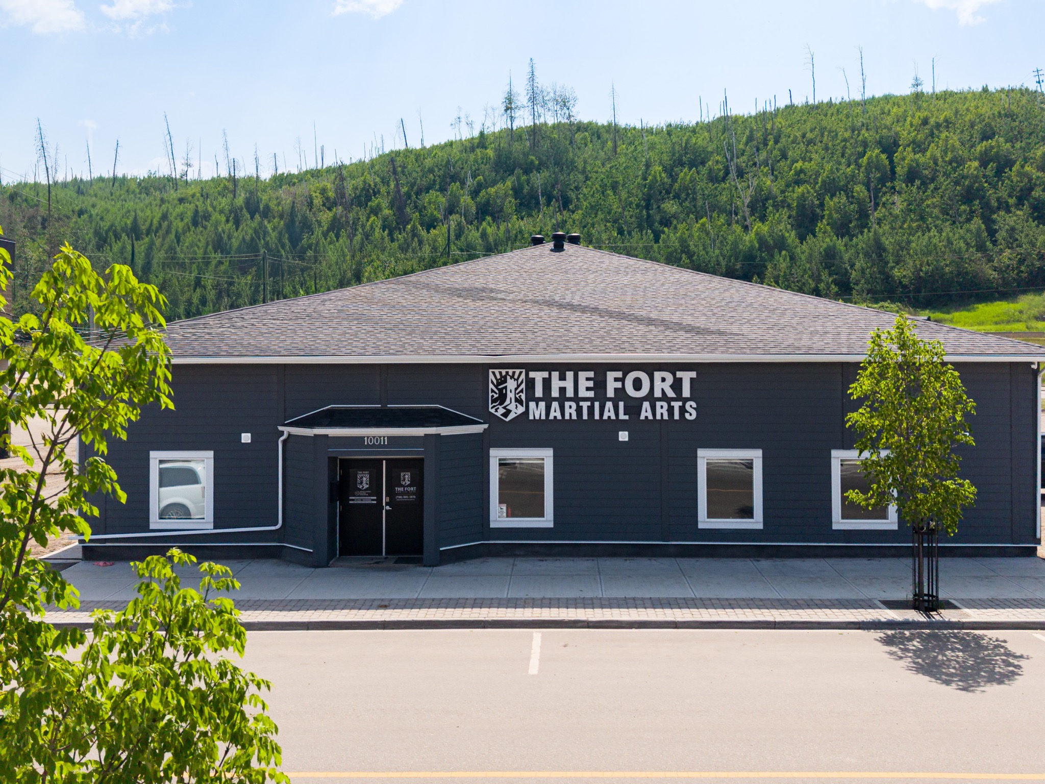 The front entrance and exterior sign of The Fort Martial Arts in Fort McMurray