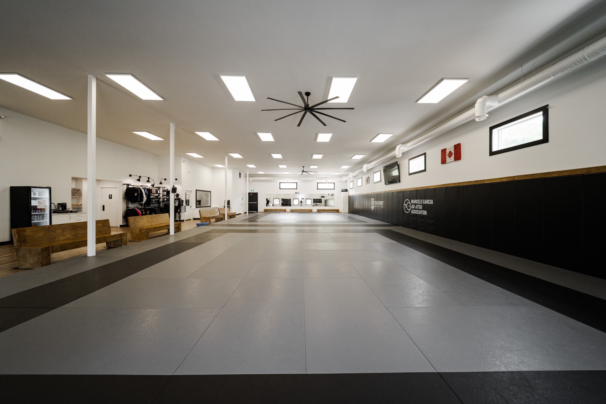 The Fort’s full training floor with grey mats, padded walls and seating