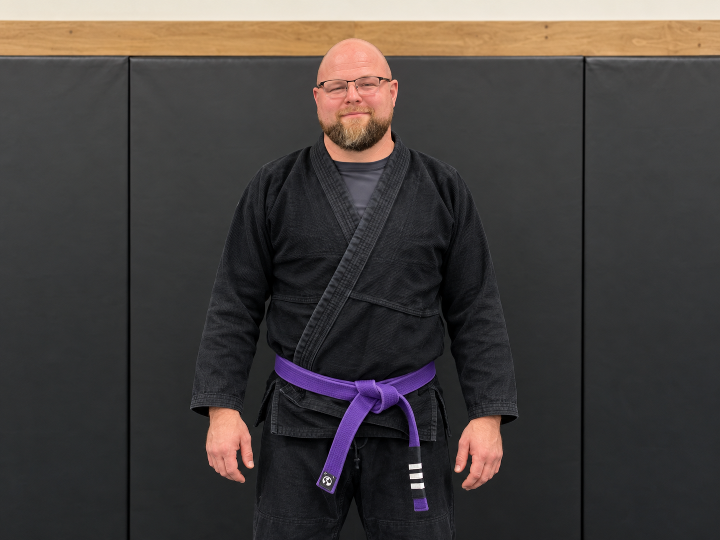 Greg Turner wearing his black gi and purple belt at The Fort