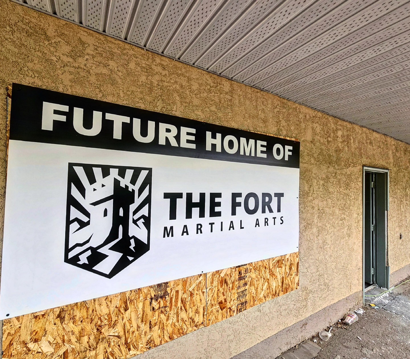 A construction sign announcing the future home of The Fort Martial Arts